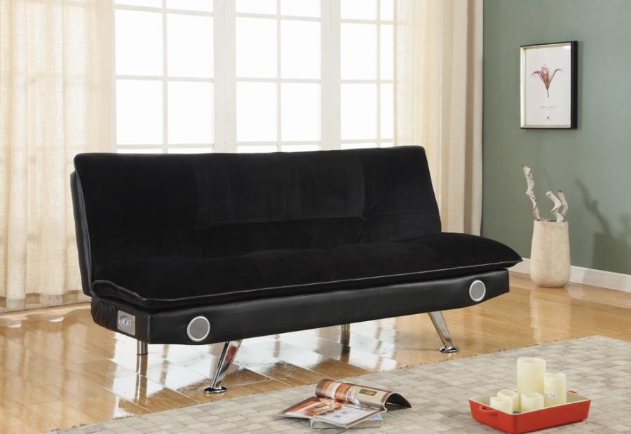 red and black futon with speakers